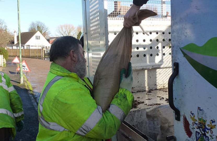 Handing out sanbags and sacks