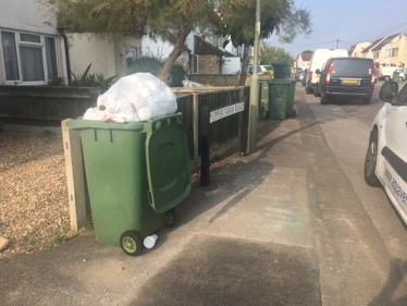 An overflowing bin in Upper Farm Road, West Molesey